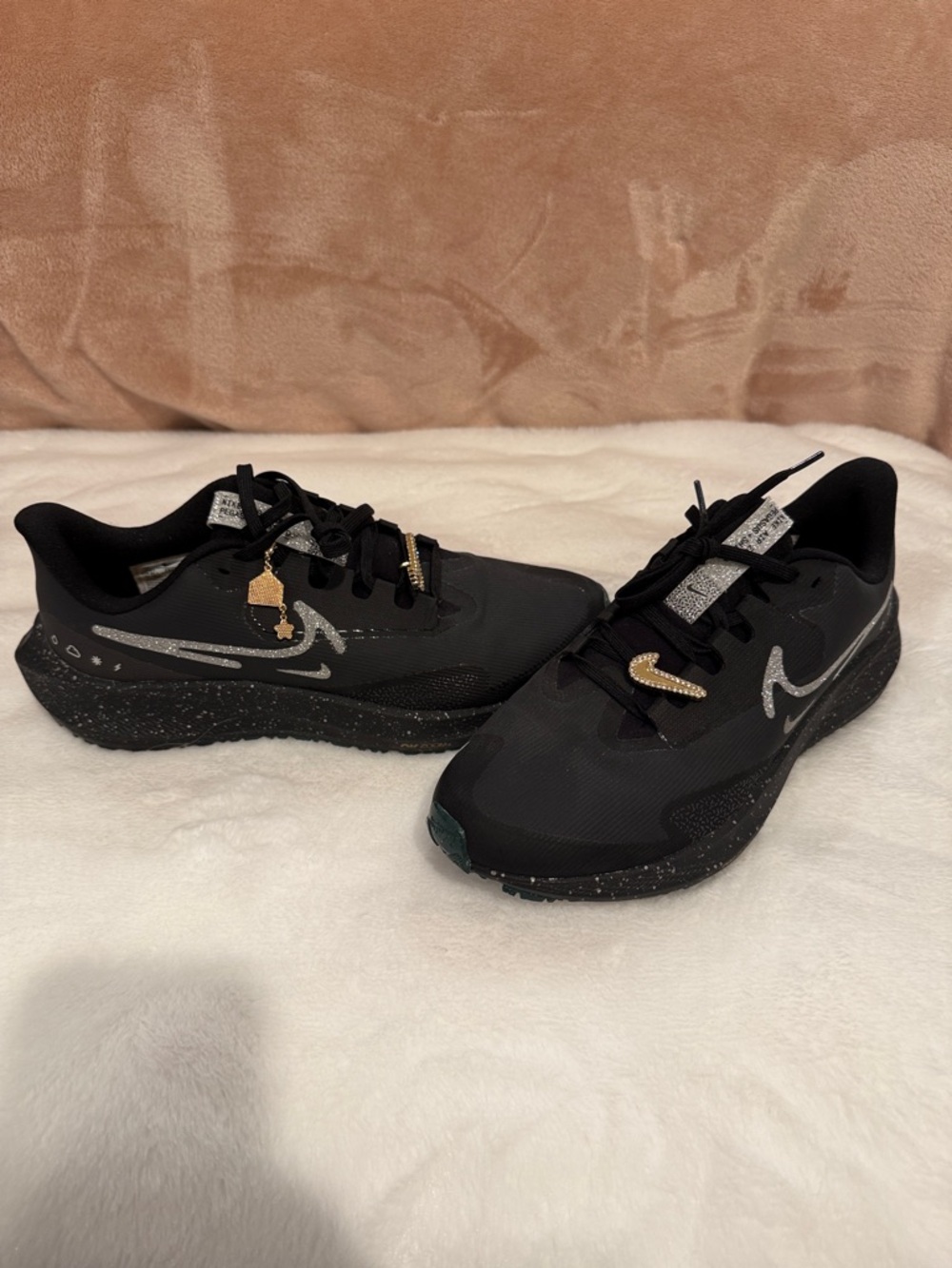 Nike Black Running Shoes with Silver and Gold Swoosh Accents